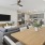 a living room with a large table and a large tv