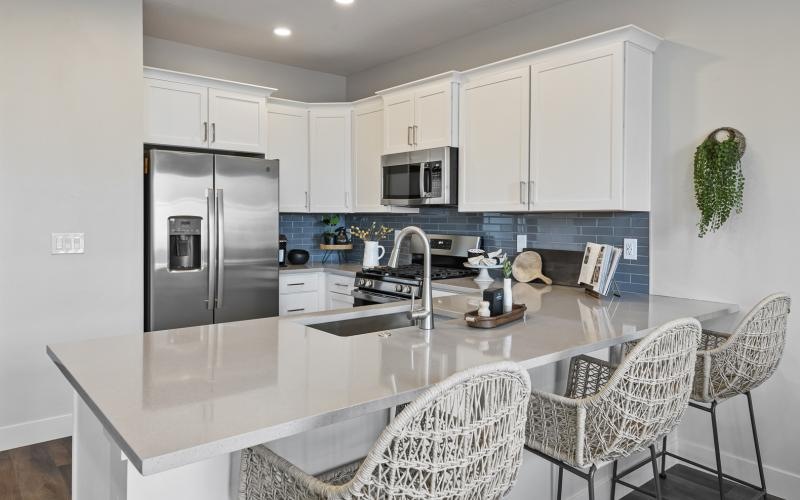 a kitchen with white cabinets