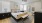 a bedroom with a bed and a fan