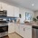 a kitchen with white cabinets